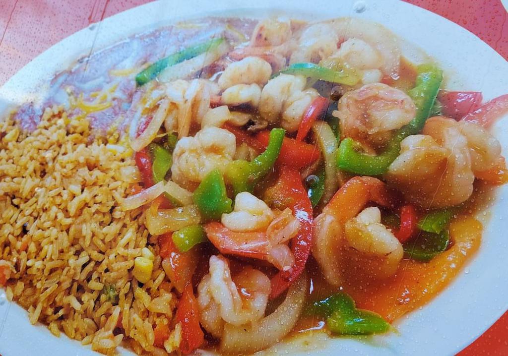Camarones Rancheros · Comes with shrimp, mushrooms, onions, bell pepper, and ranchero sauce, with rice and refried beans on the side. 