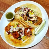 Shrimp taco grilled  · Fried with bell pepper, onion, and seasoning and comes with lettuce, pico de gallo, sauce on...