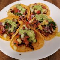 Taco especial · Comes on a corn tortilla with guacamole, pico de gallo, and your choice of meat 