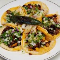 Taco  · Taco with cilantro, onion, and your choice of meat 
