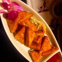Golden Tofu · Crispy tofu marinated with bread crumbs. Served with peanut sweet chili sauce.
