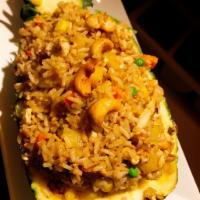 Thai Pineapple Fried Rice · Thai fried rice with chicken, shrimp, pineapple, vegetables, cashew nuts.
