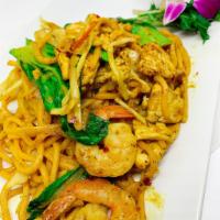 Singapore Noodles · Stir fried Lo mein noodle (egg noodle) with yellow curry sauce, combination with chicken and...