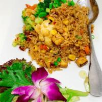 Chili Garlic Fried Rice · Fried Rice with egg garlic, green peas, corns and carrots.