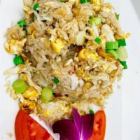 Thai Crab Fried Rice · Thai Fried rice with eggs, butter, claws and lump crabs meat, peas, corn carrots and scallio...