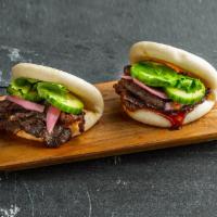 Marinated Beef Bao Bun . · Steamed bao buns (2 pcs) with marinated beef, pickled red onion, cucumber, hoisin, and cilan...