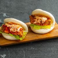 Spicy Fried Chicken Bao Bun . · Steamed bao buns (2 pcs) with fried chicken, chili seasoning, slaw, and lettuce.
Contains: G...