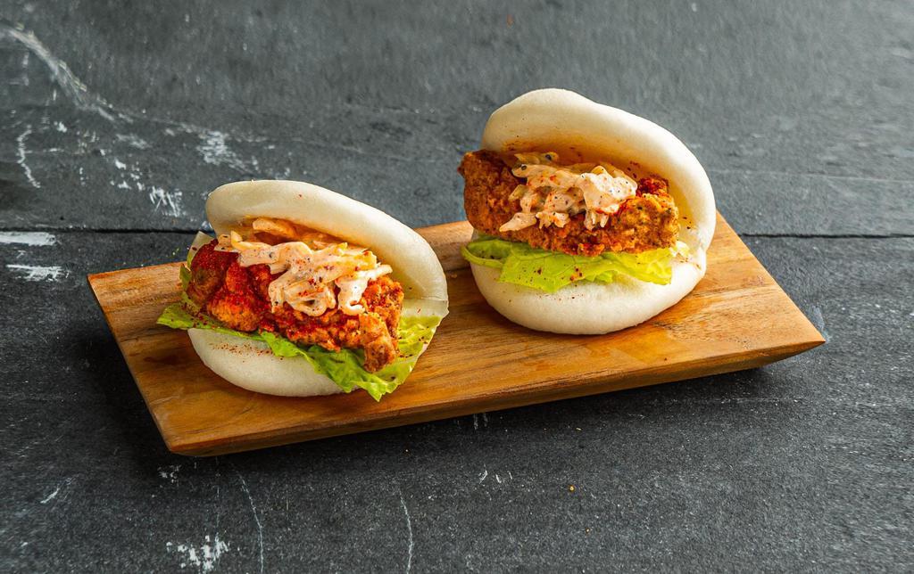 Spicy Fried Chicken Bao Bun . · Steamed bao buns (2 pcs) with fried chicken, chili seasoning, slaw, and lettuce.
Contains: Gluten, Eggs