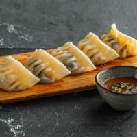 Chicken & Cabbage Dumplings . · Chicken dumplings (5pcs).
Served with sweet soy dipping sauce.
Contains: Gluten, Soy
