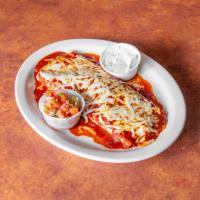 39. Hot & Spicy Burrito Specialty · Large flour tortilla stuffed with beef, beans, rice, and Chile Colorado. Topped with melted ...