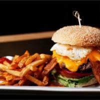 Burger with the Lot · Lettuce, tomato, pickled beetroot, caramelized onions, cheddar, bacon, fried egg and fries.