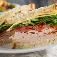 California Dreaming · roast turkey breast, swiss, avocado, beefsteak tomato + lemon aioli on sunflower wheat