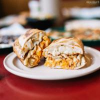 Buffalo Chicken Sandwich · Grilled chicken, spicy wing sauce, ranch, and smoked provolone. Served toasty on a Tuscan ba...