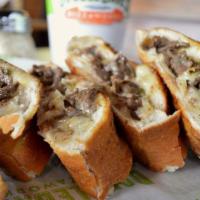 Philly Cheese Steak · Recommended. Seasoned steak, Mozzarella, and white American cheese folded in an original cru...