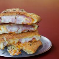Ham & Cheese Stromboli · Smoked ham, cheddar, and white American cheese folded in an original crust, rolled in cornme...