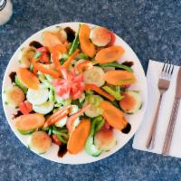 Veggie Salad · Romaine, iceberg, cucumbers, carrots, tomatoes, bell peppers, celery and raspberry vinaigret...