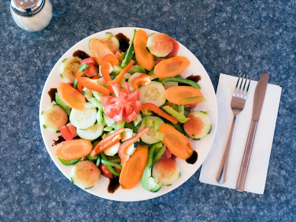 Veggie Salad · Romaine, iceberg, cucumbers, carrots, tomatoes, bell peppers, celery and raspberry vinaigrette.