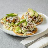 Tostadas  · 3 fried tostadas topped chicken, refried beans, lettuce, tomato, choice of meat, Cotija chee...