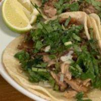 Carnitas Taco · Taco Platter comes with (3) Tacos topped with Onions and Cilantro, and Rice and Beans. 