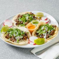 Chorizo Taco · Taco Platter comes with (3) Tacos topped with Onions and Cilantro, and Rice and Beans. 