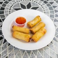 Vegetarian Spring Rolls · Crispy rolls, filled with vegetables, herbs, & spices. Served with honey-chili sauce. 5 piec...