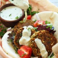 Falafel Gyro · Falafel, lettuce, tomatoes, onions. Choose your dressing. Free can soda or water.