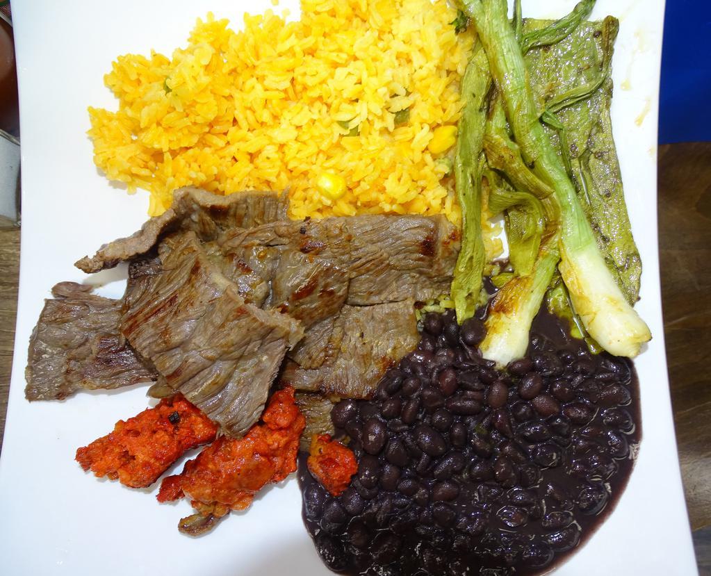 Cecina Con Nopales · Aged beef with Cactus Pad - Served with Rice & Beans.