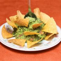 Guacamole de la Casa · Home made guacamole with nachos.