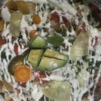 Nachos de Bistec · Steak. Served with beans, cheese, sour cream and jalapenos.