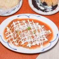 Chiles Rellenos Platillo · Roasted pueblan peppers stuffed with fresh cheese in a tomato sauce. Served with Mexican ric...