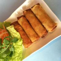 A1. Spring Rolls · Vietnamese spring rolls with shrimp, pork, mushrooms, lettuce, and herbs with lemon fish sau...