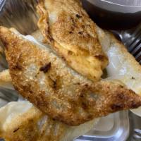 A7. Fried Dumplings · Chicken dumplings with ginger soy vinaigrette.