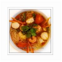 Tom Yum Seafood Noodle Soup · With shrimp, scallops, calamari, and rice vermicelli. Hot and spicy.