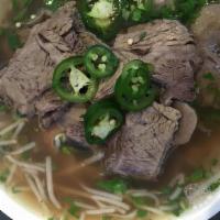 PH3. Pho with Brisket · Served with flat rice noodle, onion, scallion, cilantro in beef broth.