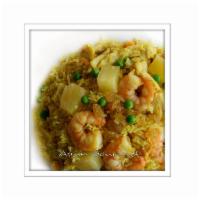Thai Pineapple Fried Rice · With pineapple, raisin, chicken, shrimp, onions, peas, and egg.