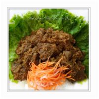 B14. Malaysia Dried Curry Beef · With lemongrass coconut curry sauce. Hot and spicy.