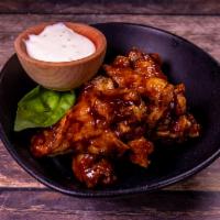 Wings · Served with a 2 oz. cup of ranch or blue cheese for every 10 pieces.