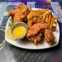 Fried Lobster Tails · 2 jumbo lobster tails seasoned and deep-fried. Served with fries.