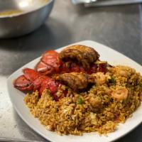 Grilled Stuffed Lobster Tails · 2 Grilled jumbo lobster tails Cajun-style. Stuffed with rice, shrimp, peppers and served wit...