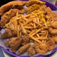 Plush Combo Platter · 2 catfish fillets, 6 jumbo shrimp, 6 wings, 3 chicken tenders, and seasoned fries.