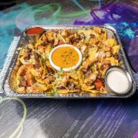 Big Dumb Nachos · Loaded with grilled fajita chicken, beef, shrimp, and cheese with a side of lettuce, jalapen...