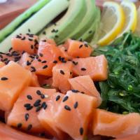 Salmon Poke · Salmon, seaweed salad, cucumber, avocado and lemon.