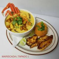 Mariscada Soup · Tapado Soup. A delicious seafood soup-fried fillet of fish, yuca, shrimp, king crab, clams, ...