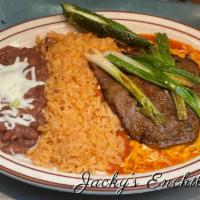 Jacky's Enchilada · 2 enchiladas, choice of chicken, shredded beef, ground beef, or cheese topped with ranchero ...