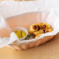 Pigs in a Blanket · 6 pieces. Comes with spicy brown mustard.