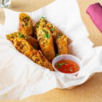 Spring Rolls · 4 pieces.  with sweet chili sauce.