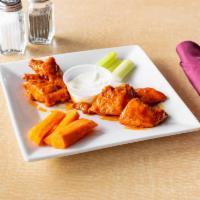 Boneless Chicken Wings · 6 pieces. Comes with a choice of sauce.
