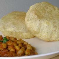 Chole Bhatura · Chickpea curry made with tomato, onion, Thai chilies, garlic, cashew and Indian spices, topp...