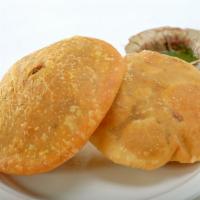 Kachori · Bengali version of fried flat round pastry filled with green peas and hing. Priced per Piece...