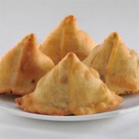 Shingara · Bengali version of triangular pastry stuffed with cauliflower, potato, peas and Indian spice...